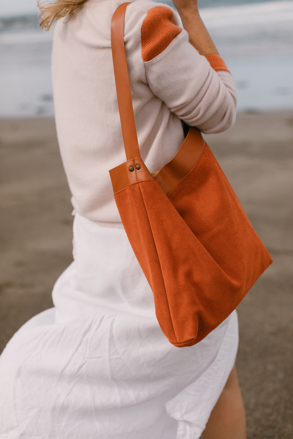 Orange best sale suede bag